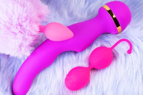 Purple and pink adult toys on a light blue carpet